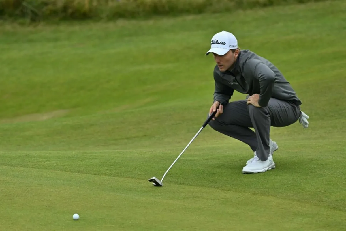 US golfer Russell Henley lines up a putt on the 8th hole during his final round,  on day four of the 152nd British Open Golf Championship at Royal Troon on the south west coast of Scotland on July 21, 2024.  Glyn KIRK / AFP