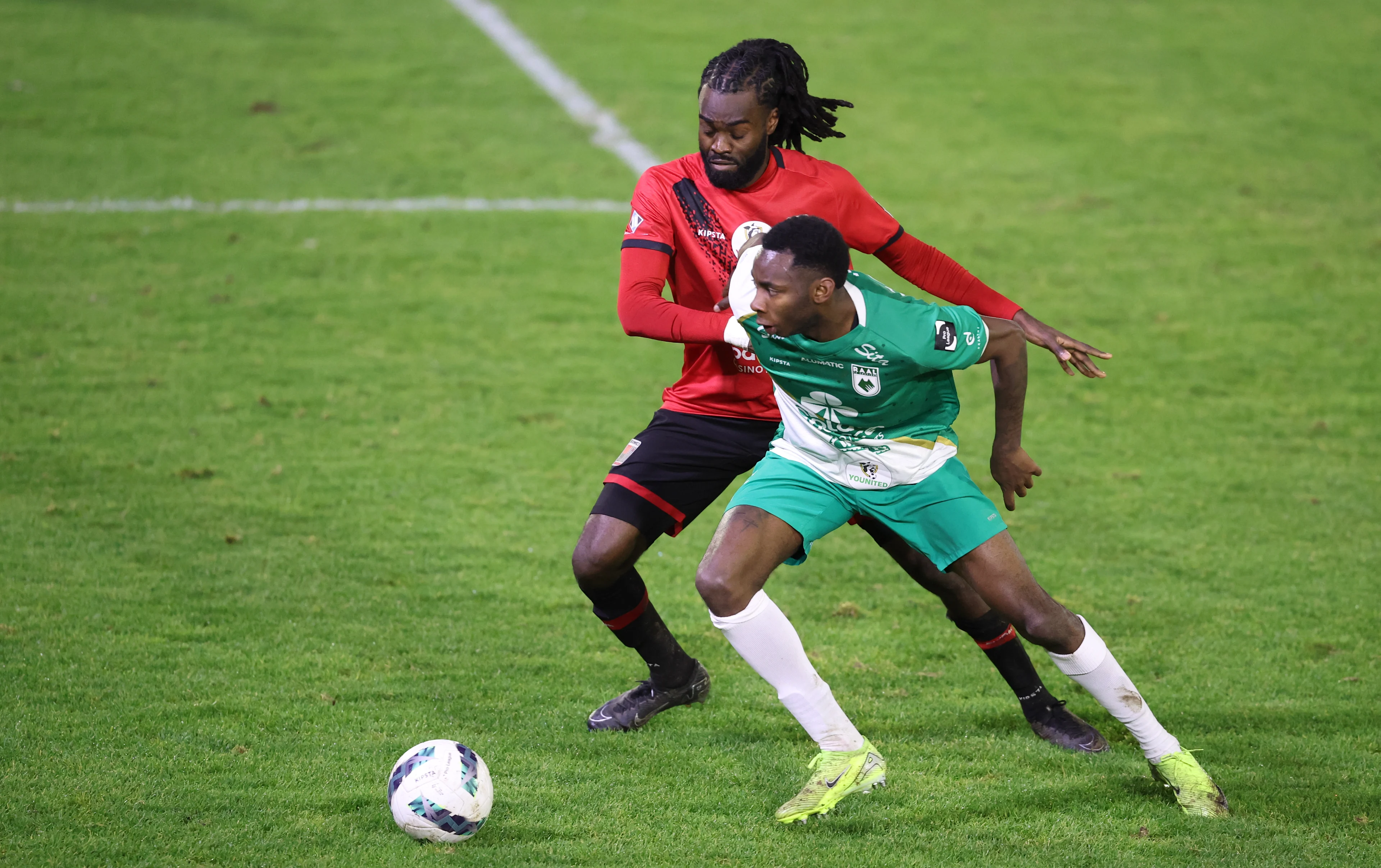 Rwdm's Mansoni Sambu and RAAL's Kenny Nagera fight for the ball during a soccer match between RAAL La Louviere and RWD Molenbeek, Saturday 21 December 2024 in La Louviere, on day 16 of the 2024-2025 'Challenger Pro League' 1B second division of the Belgian championship. BELGA PHOTO VIRGINIE LEFOUR