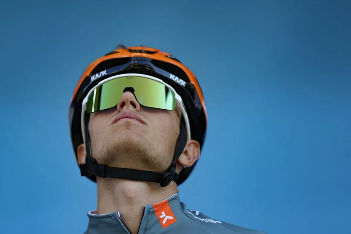 Netcompany Ineos Cycling Team's British rider Oscar Onley awaits the start of the 2nd stage of the Tour Auvergne-Rhone-Alpes cycling race (formerly known as the Criterium du Dauphine), 234,3km between Saint-Martin-Le-Vinoux and Le Puy-en-Velay, in the French Alps, on June 8, 2026. Anne-Christine POUJOULAT / AFP