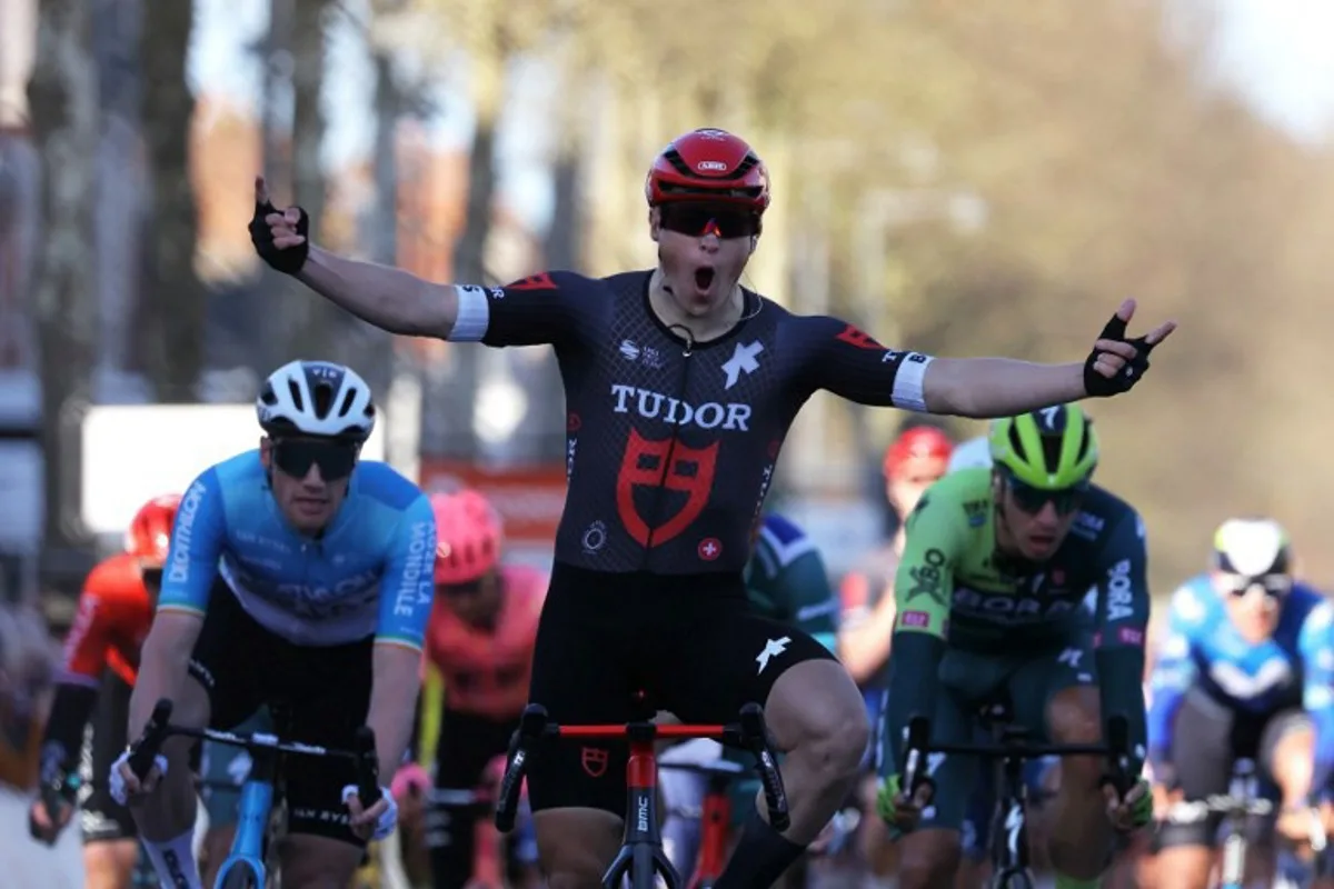 Tudor Pro Cycling Team's Dutch cyclist Arvid De Kleijn celebrates as he crosses the finish line during the 2nd stage of the Paris-Nice cycling race, 179 km between Thoiry and Montargis, on March 4, 2024.  Thomas SAMSON / AFP