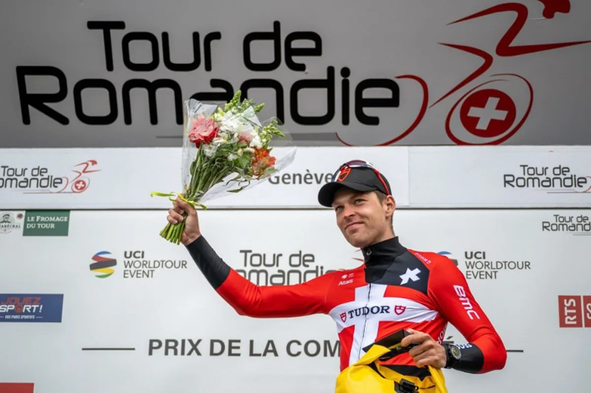 Danish rider Alexander Kamp poses on the podium with the combativity prize after the final stage of the Tour of Romandie UCI cycling World tour, 170.8 km from Vufflens-la-Ville to Geneva, on April 30, 2023.  Fabrice COFFRINI / AFP