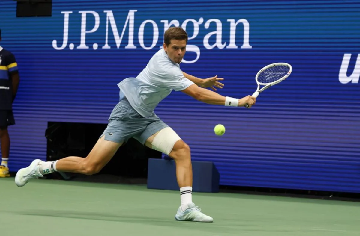 Belgium's Alexander Blockx returns the ball to Russia's Karen Khachanov during the men's singles quarter-final tennis match on day eleven of the US Open tennis tournament at the USTA Billie Jean King National Tennis Center in New York City on September 9, 2026. TIMOTHY A. CLARY / AFP