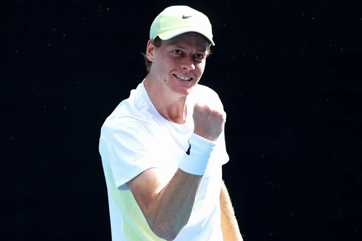 Italy's Jannik Sinner celebrates the match point against Denmark's Holger Rune after the men's singles match on day nine of the Australian Open tennis tournament in Melbourne on January 20, 2025.  Martin KEEP / AFP