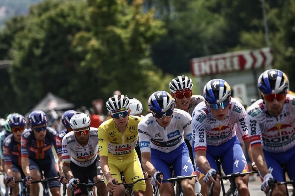 (From 3rd L) UAE Team Emirates - XRG team's Ecuadorian rider Jhonatan Narvaez, UAE Team Emirates - XRG team's Slovenian rider Tadej Pogacar wearing the overall leader's yellow jersey, Red Bull - BORA - hansgrohe team's German rider Florian Lipowitz wearing the best young rider's white jersey, UAE Team Emirates - XRG team's German rider Nils Politt cycle with the pack of riders (peloton) during the 20th stage of the 112th edition of the Tour de France cycling race, 184.2 km between Nantua and Pontarlier, in the Jura, eastern France, on July 26, 2025.  Anne-Christine POUJOULAT / AFP