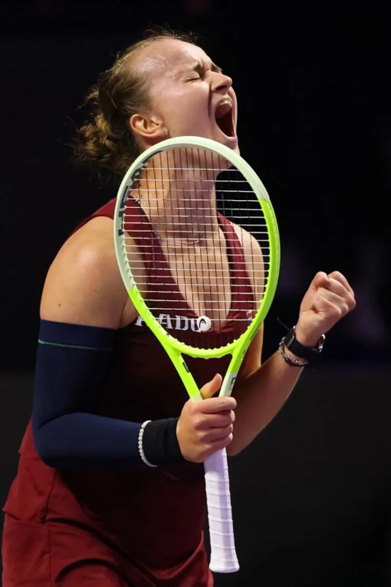 Czech Republic's Barbora Krejcikova celebrates after winning against US' Coco Gauff during their women's singles tennis match at the WTA Finals Championship in Riyadh on November 7, 2024.  Fayez NURELDINE / AFP