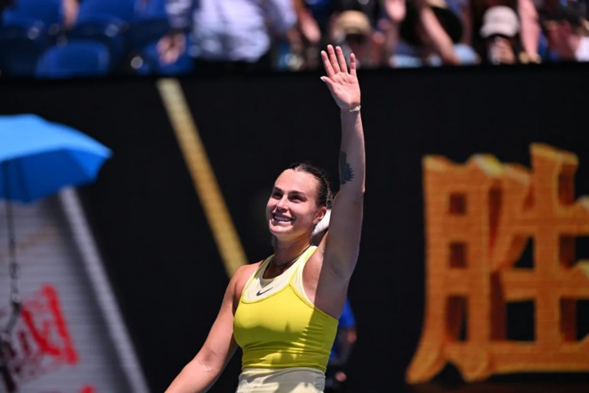 Belarus' Aryna Sabalenka waves as she celebrates beating Russia's Mirra Andreeva in their women's singles match on day eight of the Australian Open tennis tournament in Melbourne on January 19, 2025.  WILLIAM WEST / AFP