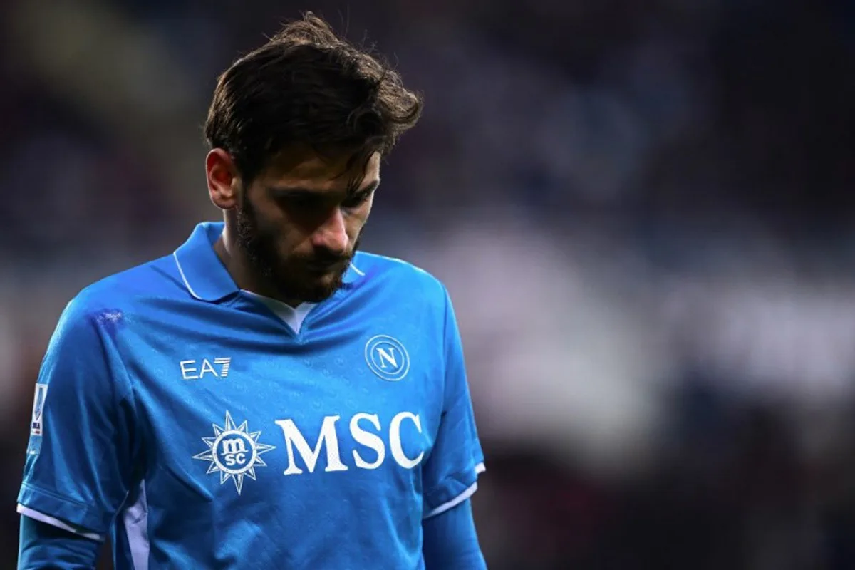 Napoli's Georgian forward #77 Khvicha Kvaratskhelia leaves as he is substituted during the Italian Serie A football match Torino vs Napoli at the "Stadio Grande Torino" in Turin on December 1, 2024.   MARCO BERTORELLO / AFP