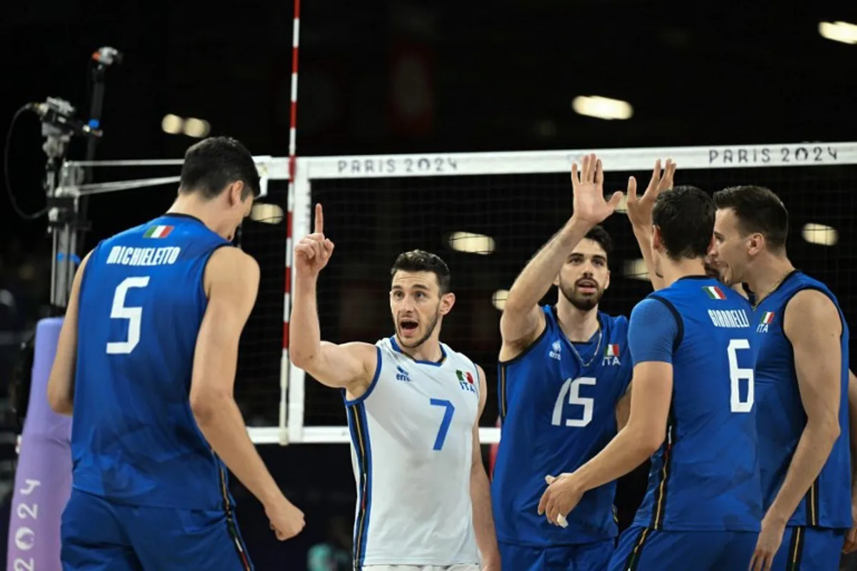 Italy's players congratulate each other during men's volleyball bronze medal match between Italy and USA at the South Paris Arena 1 in Paris on August 9, 2024 during the Paris 2024 Olympic Games. Natalia KOLESNIKOVA / AFP