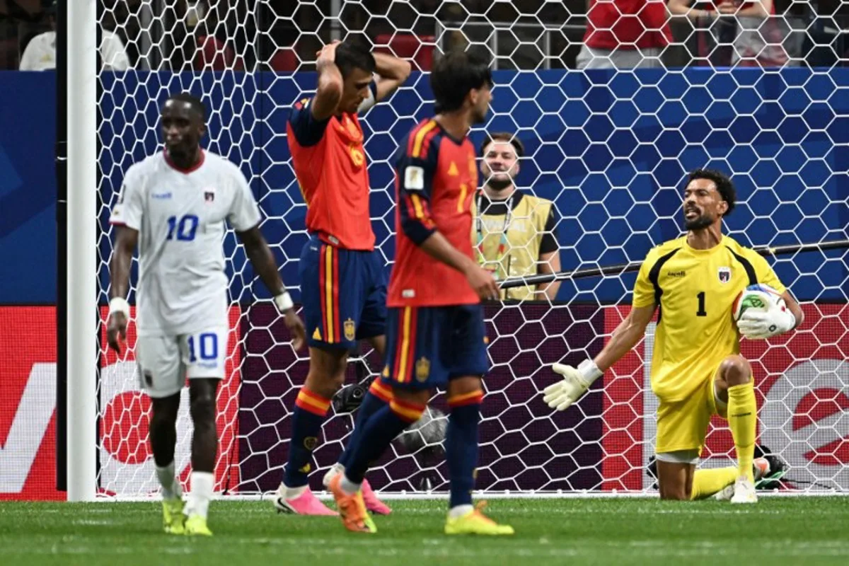 Cape Verde's goalkeeper #01 Vozinha (R) reacts during the 2026 World Cup Group H football match between Spain and Cape Verde at the Atlanta Stadium in Atlanta on June 15, 2026. Roberto SCHMIDT / AFP