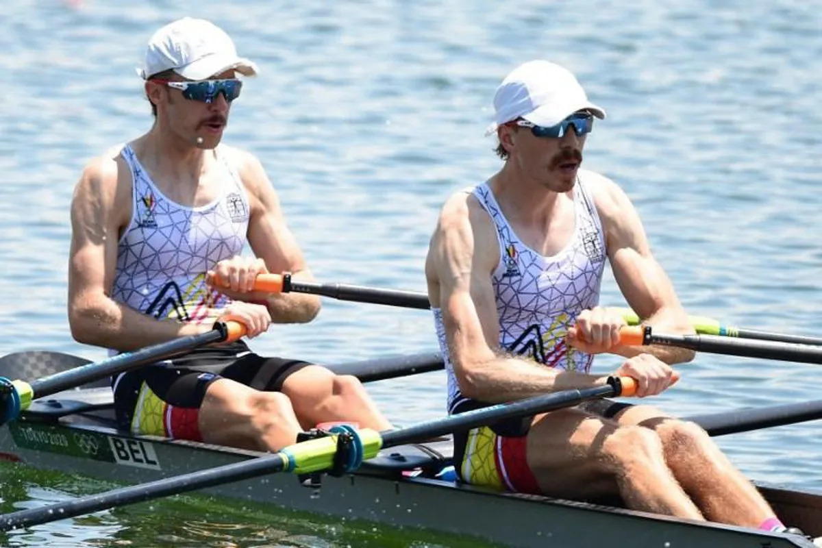 Belgium's Niels Van Zandweghe (L) and Belgium's Tim Brys compete in the lightweight men's double sculls heats during the Tokyo 2020 Olympic Games at the Sea Forest Waterway in Tokyo on July 24, 2021.  Luis ACOSTA / AFP