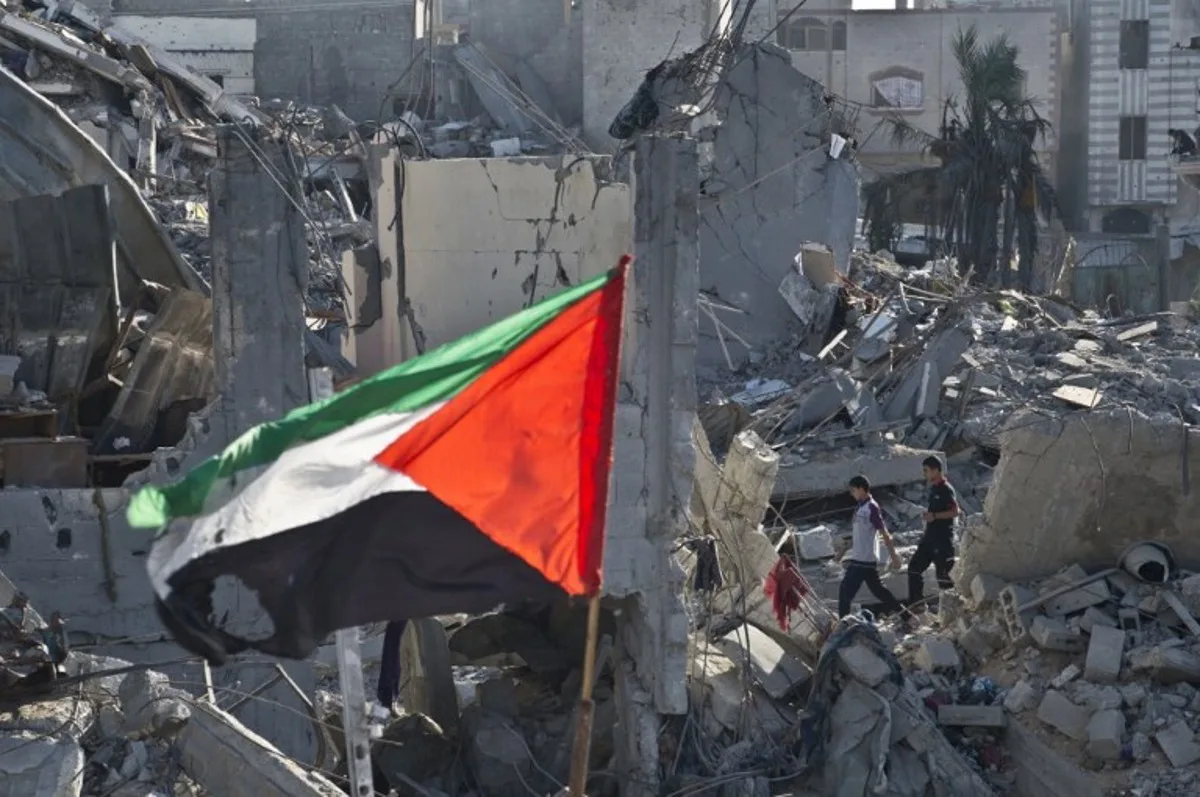 Two Palestinian boys walk amid the rubble of destroyed homes in Shejaiya on August 27, 2014. Shejaiya is one of the hardest hit neighborhoods in fighting between Hamas militants and Israel during 50 days of fighting. Israel and Palestinians both boasted of victory in the Gaza war but analysts say Hamas received only promises while the conflict aggravated divisions in the Israeli leadership. AFP PHOTO / ROBERTO SCHMIDT Roberto SCHMIDT / AFP