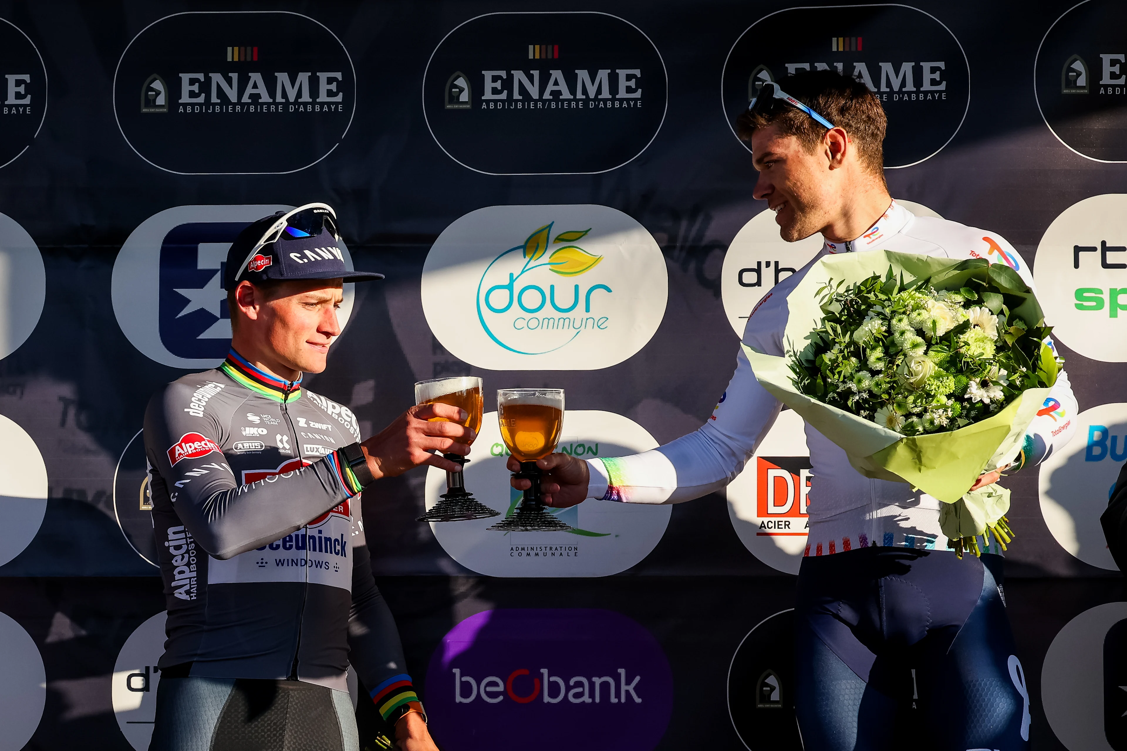 French Paul Magnier of Soudal Quick-Step, Dutch Mathieu van der Poel of Alpecin-Deceuninck and French Emilien Jeanniere of TotalEnergies pictured on the podium after the 'Ename Samyn Classic' one day cycling race, 199,1km from Quaregnon to Dour on Tuesday 04 March 2025. BELGA PHOTO VIRGINIE LEFOUR