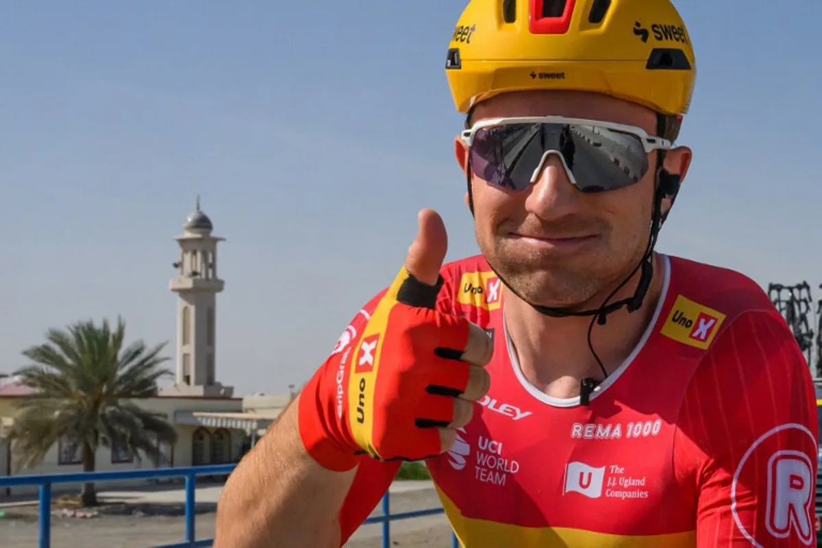 Uno-X Mobility Norvegian rider Erlend Blikra gives a thumb up after winning the 4th stage of the Tour of Oman cycling race from Al Sawadi to Sohar, on February 10, 2026.  Loic VENANCE / AFP