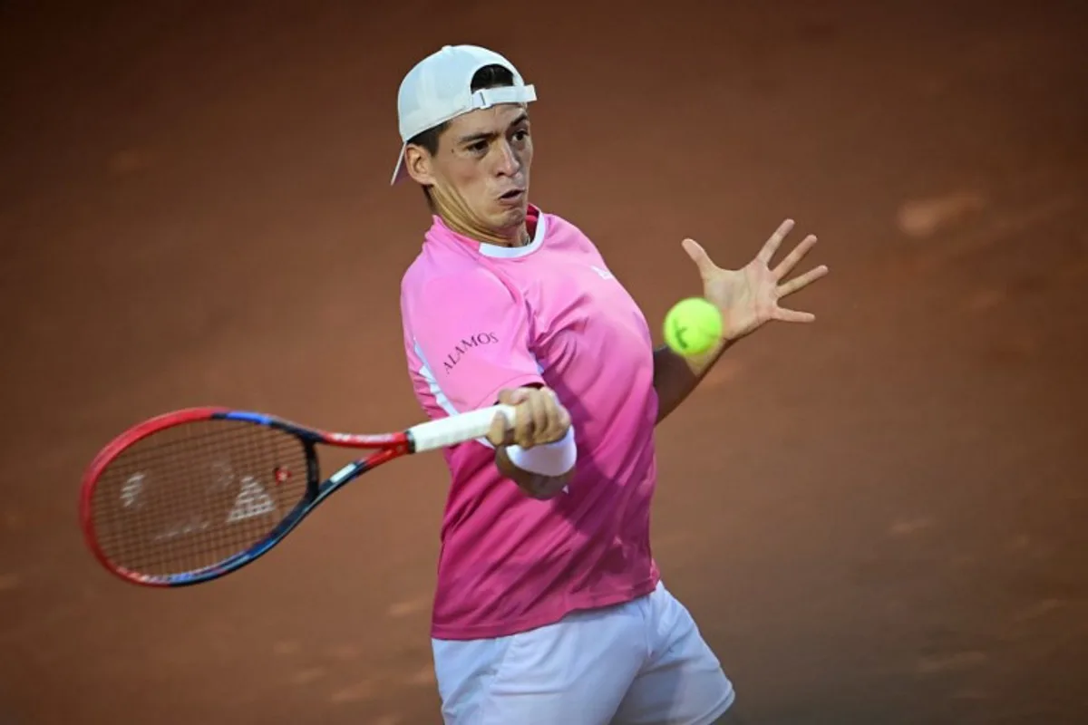 Argentina's Sebastian Baez returns the ball to France's Alexandre Muller during the ATP 500 Rio Open final tennis match at the Gavea Jockey Club in Rio de Janeiro, Brazil, on February 23, 2025.  MAURO PIMENTEL / AFP