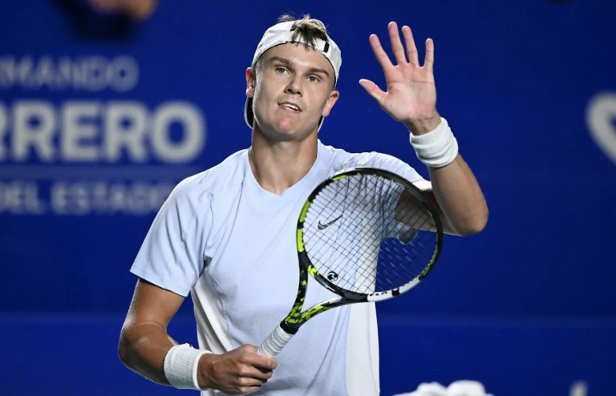 Denmark's Holger Rune celebrates after beating Spain's Roberto Carballes Baena during their 2025 Mexico ATP Open 500 men's singles tennis match at the Arena GNP Seguros in Acapulco, Guerrero State, Mexico, on February 25, 2025.  CARL DE SOUZA / AFP