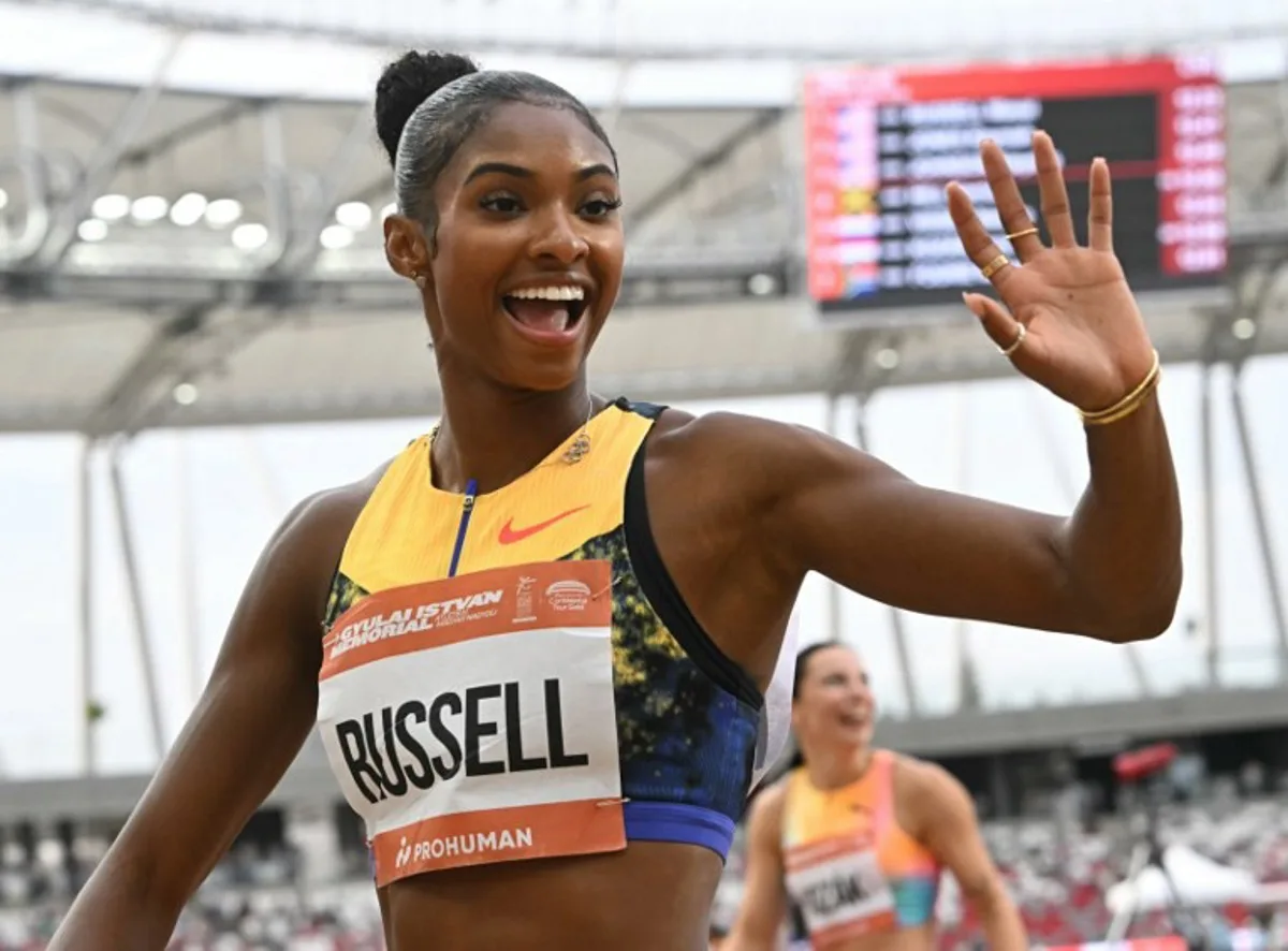 US' Masai Russell celebrates winning the women's 100m hurdles competition of the Gyulai Istvan Memorial Athletics Grand Prix in Budapest, Hungary on July 14, 2026. Attila KISBENEDEK / AFP