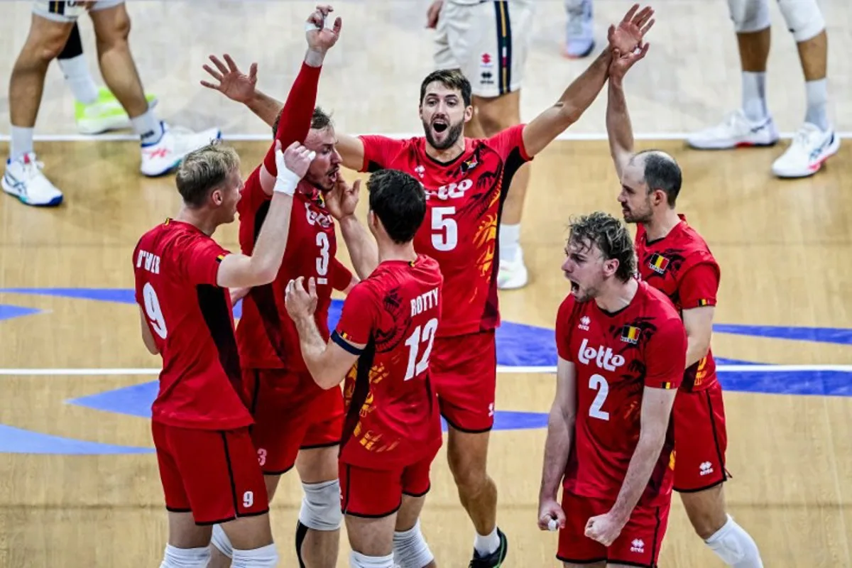 Belgium's players celebrate after scoring a point against Italy during the 2025 Men's Volleyball World Championship at the Araneta Coliseum in Quezon City on September 16, 2025. SHERWIN VARDELEON / AFP