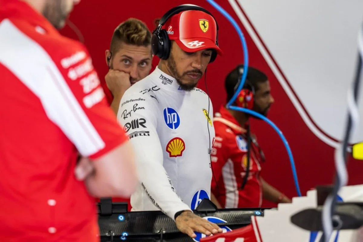 Ferrari's British driver Lewis Hamilton inspects his car during the first practice session at the Hungaroring racetrack in Mogyorod near Budapest, Hungary, on July 24, 2026 ahead of the Formula One Hungarian Grand Prix. Andrej ISAKOVIC / AFP