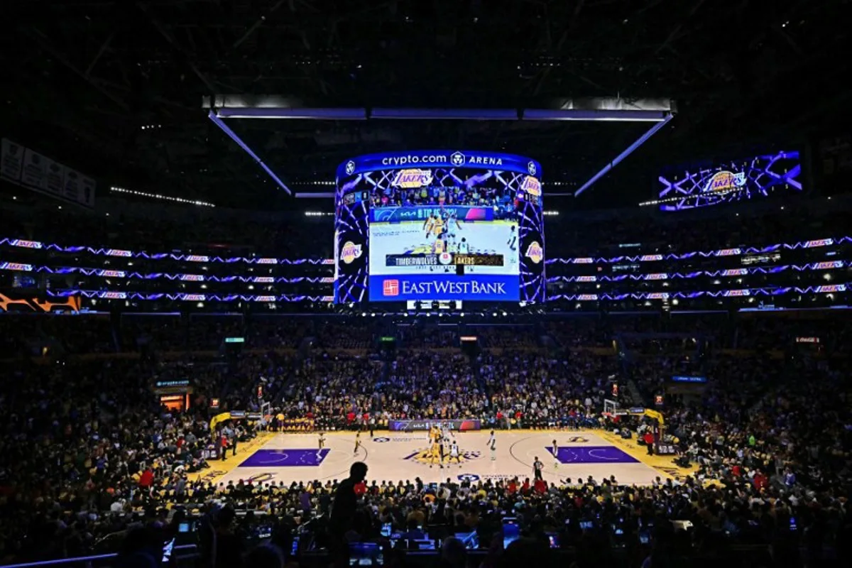 The Los Angeles Lakers and the Minnesota Timberwolves play during the NBA game season opener at Crypto Arena in Los Angeles on October 22, 2024. LeBron and Bronny are the first father and son to play together in any NBA game. Frederic J. Brown / AFP