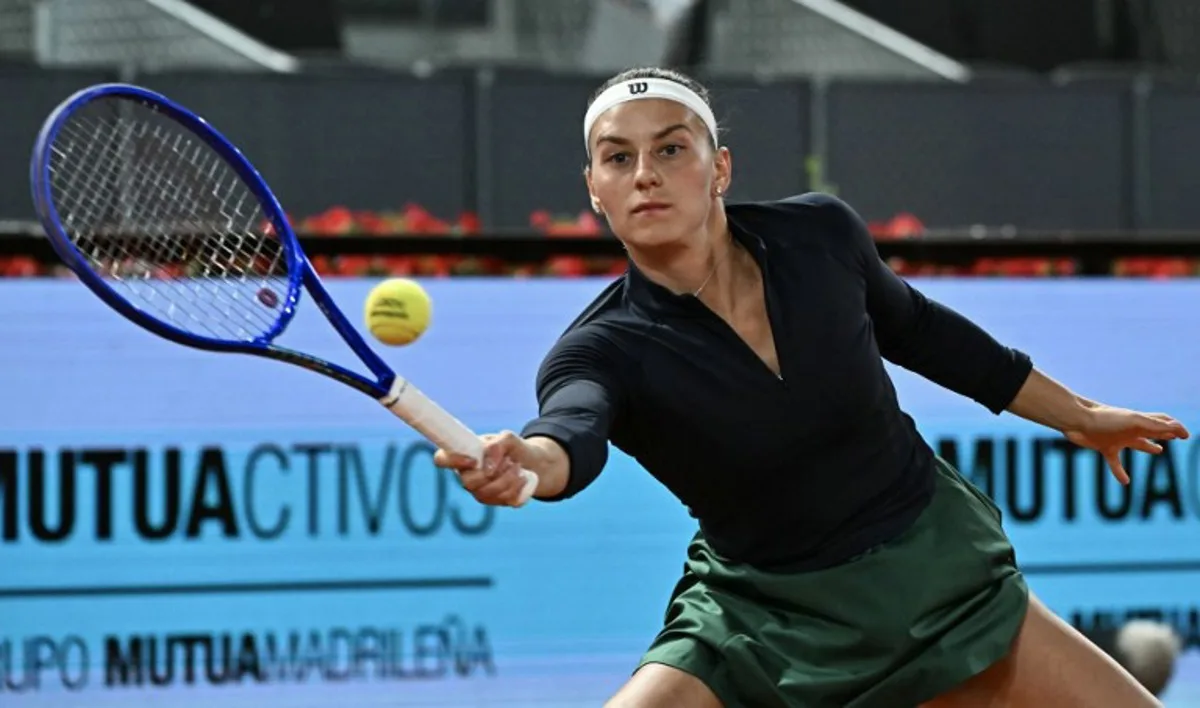 Ukraine's Marta Kostyuk returns the ball to Austria's Anastasia Potapova during their 2026 WTA Tour Madrid Open tennis tournament women's semi-final singles match at the Caja Magica in Madrid, on April 30, 2026.  Javier SORIANO / AFP