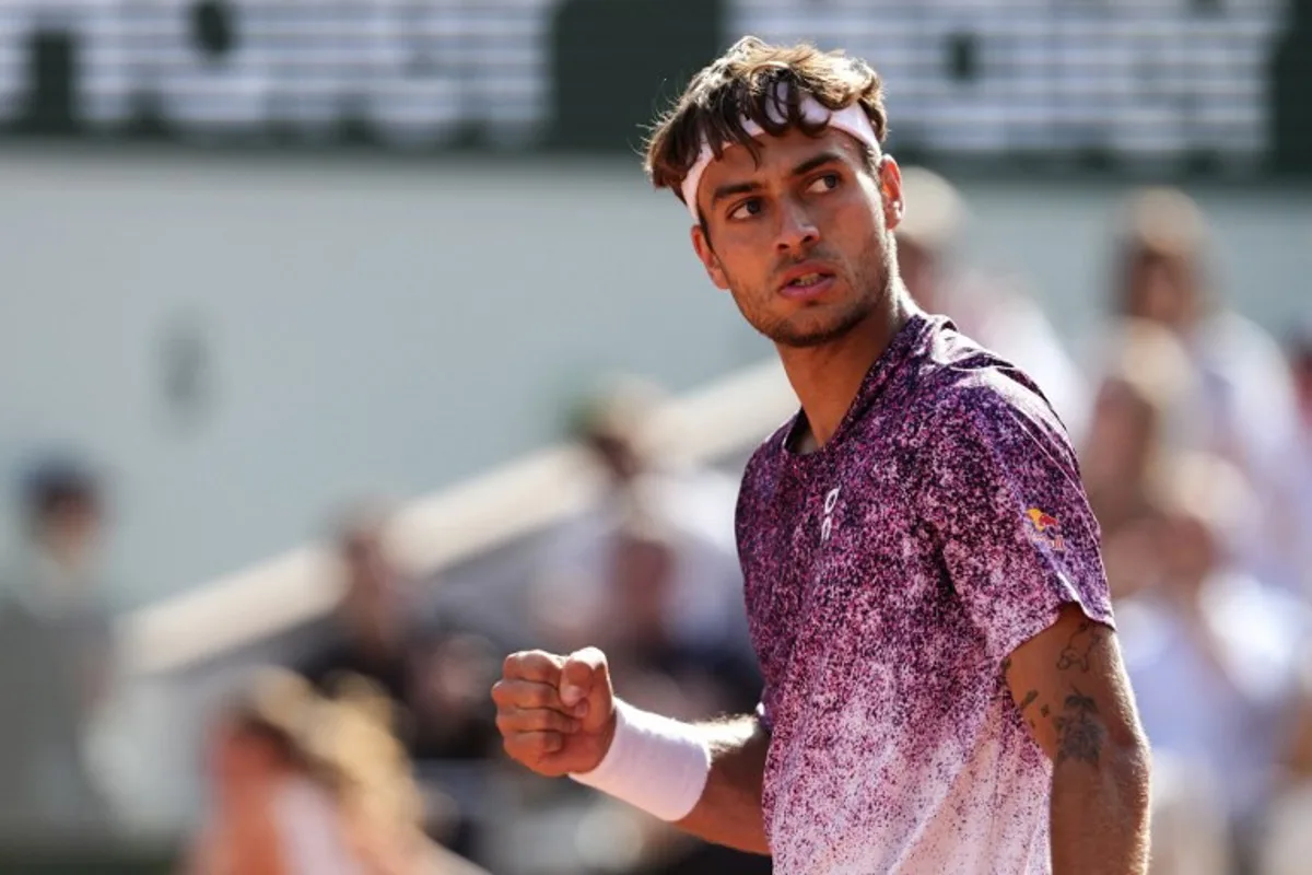 Italy's Flavio Cobolli reacts after a point as he plays against during his men's final singles match against Germany's Alexander Zverev on day 15 of the French Open tennis tournament on Court Philippe-Chatrier at the Roland-Garros Complex in Paris on June 7, 2026. Dimitar DILKOFF / AFP