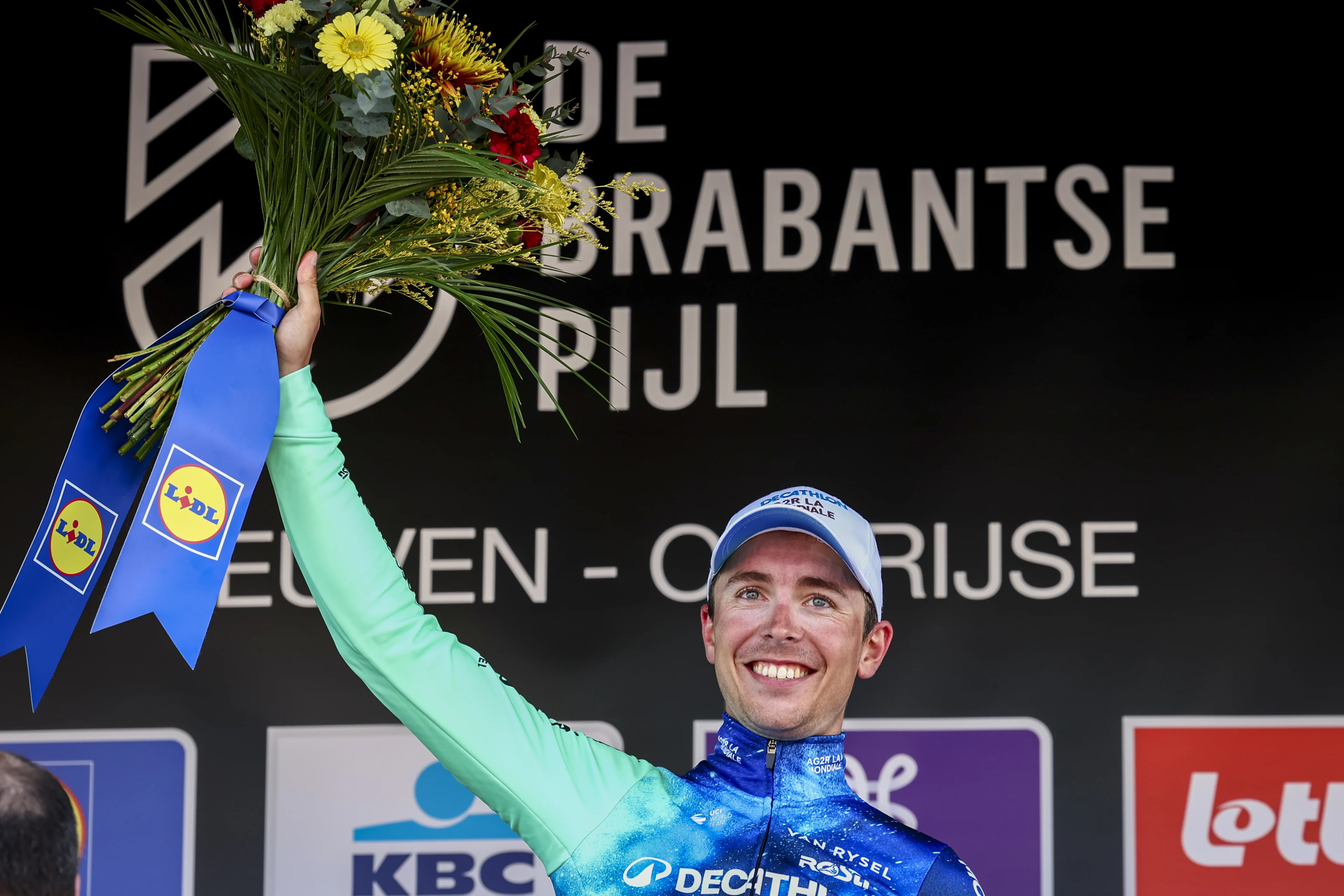 French Benoit Cosnefroy of Decathlon Ag2r La Mondiale Team celebrates on the podium after winning the men's 'Brabantse Pijl' one day cycling race, 195,2 km from Leuven to Overijse on Wednesday 10 April 2024. BELGA PHOTO DAVID PINTENS