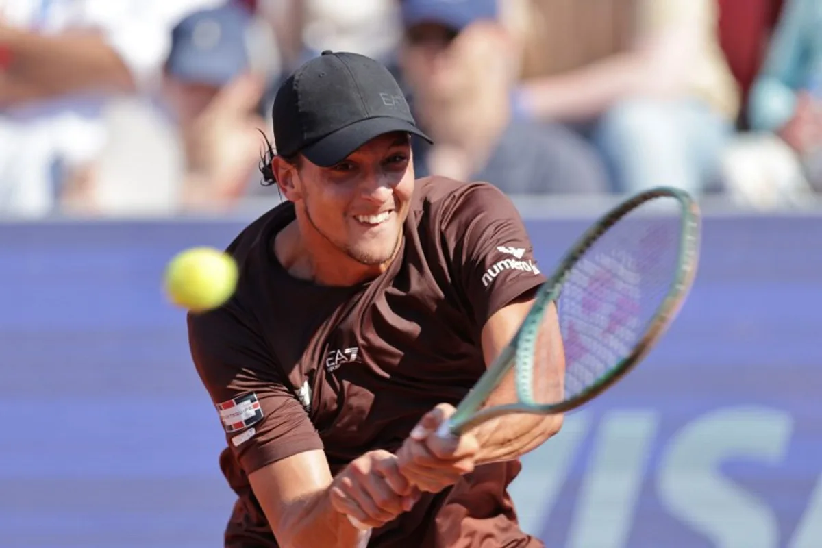 Italy's Luciano Darderi returns the ball to Argentina's Francisco Cerundolo (not pictured) during the men's singles semi-final match of the ATP Nordea Open tennis tournament in Bastad, Sweden, on July 19, 2025. Bjorn LARSSON ROSVALL / TT News Agency / AFP