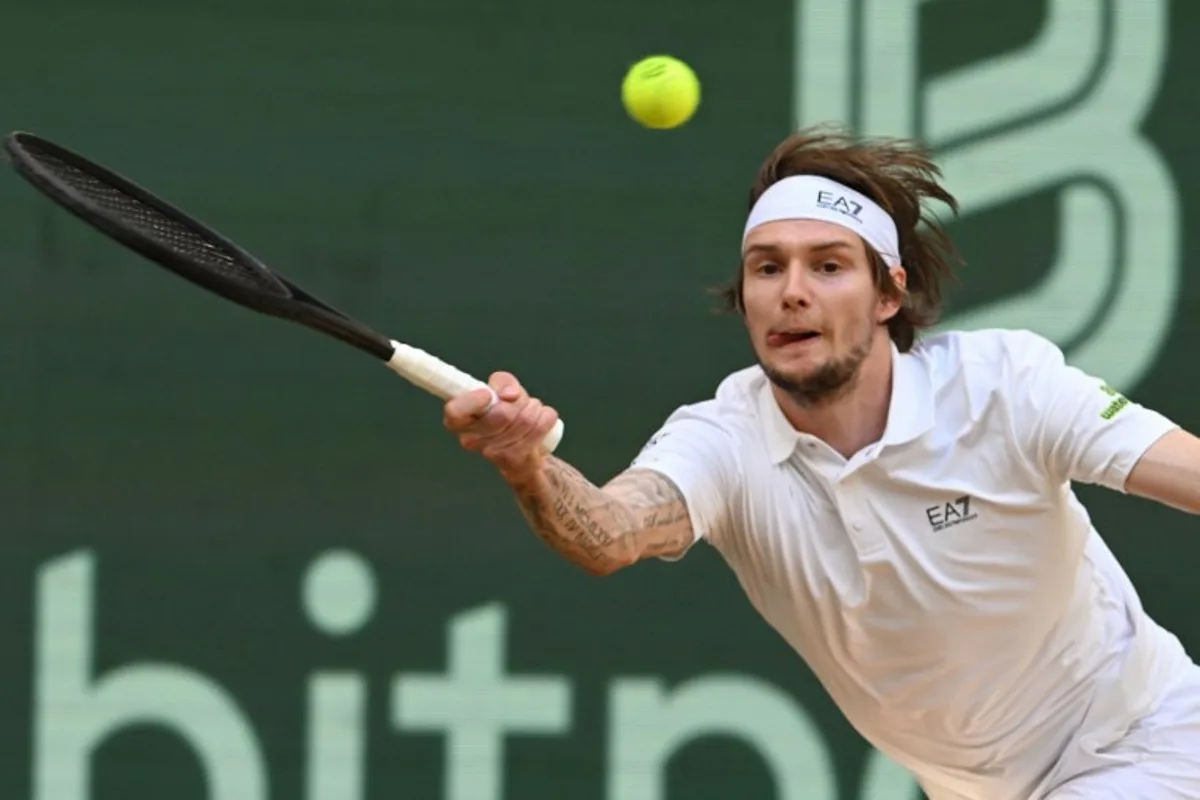 Kazakhstan's Alexander Bublik returns the ball to Russia's Karen Khachanov (not in picture) during the men's singles semi-final match at the Halle Open ATP tennis tournament in Halle, western Germany, on June 21, 2025. CARMEN JASPERSEN / AFP