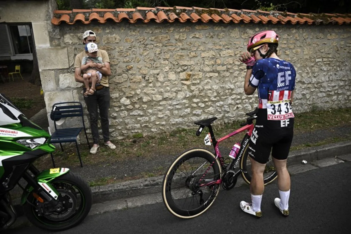 EF Education‑Oatly team's US rider Kristen Faulkner reacts after a crash during the 4th stage (out of 9) of the fourth edition of the Women's Tour de France cycling race, 130.7 km from Saumur to Poitiers, in Poitiers, western France on July 29, 2025. JULIEN DE ROSA / AFP