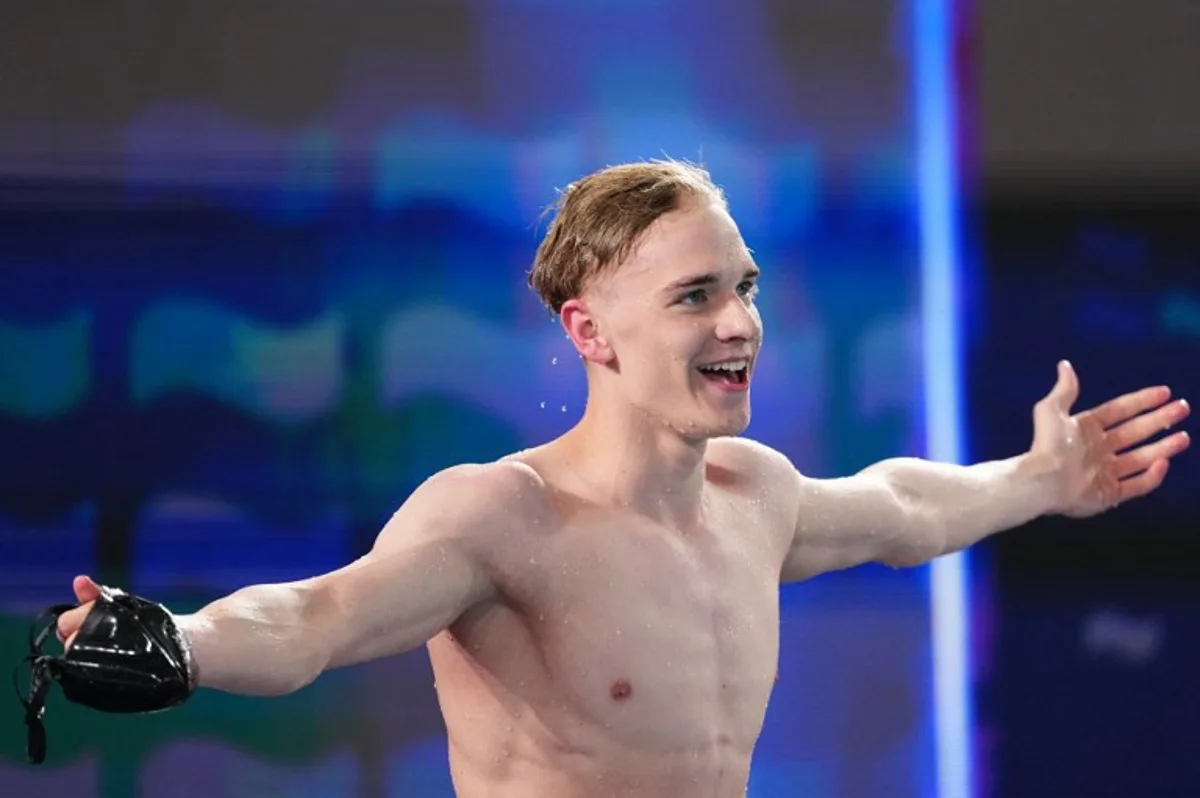 Germany's Johannes Liebmann celebrates winning the final of the men's 800m freestyle swimming event during the LEN European Aquatics Championships at the Olympic Aquatic Centre in Saint-Denis, northern suburbs of Paris, on August 12, 2026.  SEBASTIEN BOZON / AFP