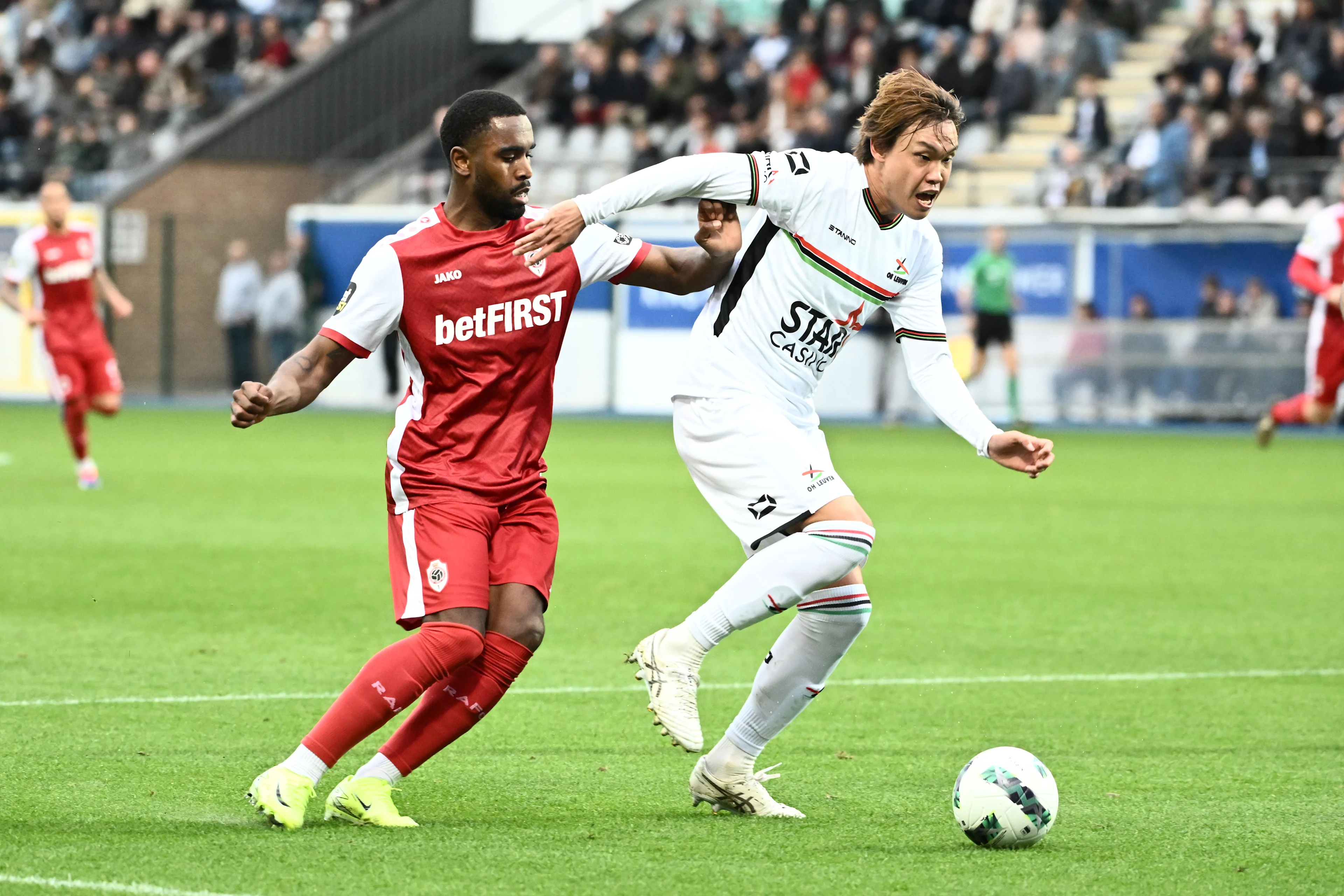 Antwerp's Gyrano Kerk and OHL's Takumi Omimami fight for the ball during a soccer match between Oud-Heverlee Leuven and Royal Antwerp, Sunday 20 October 2024 in Leuven, on day 11 of the 2024-2025 season of the 'Jupiler Pro League' first division of the Belgian championship. BELGA PHOTO MAARTEN STRAETEMANS