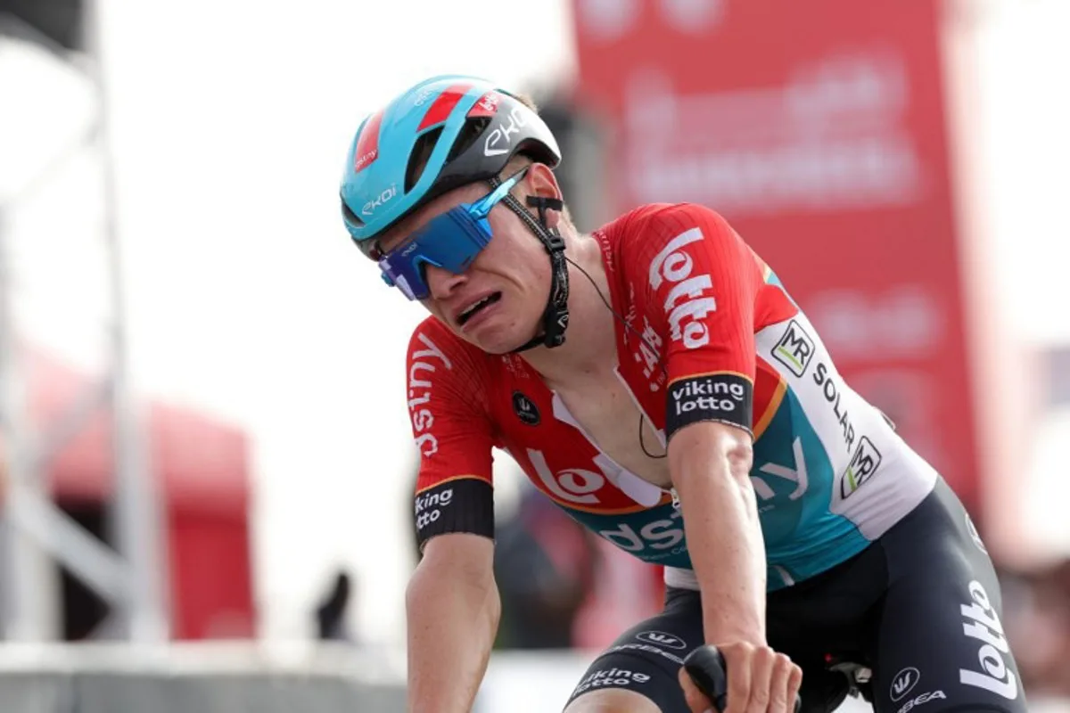 Lotto-DSTNY's Belgian cyclist Lennert Van Eetvelt reacts after winning the 7th and last stage of the 6th UAE Cycling Tour in Al-Ain on February 25, 2024.  Giuseppe CACACE / AFP