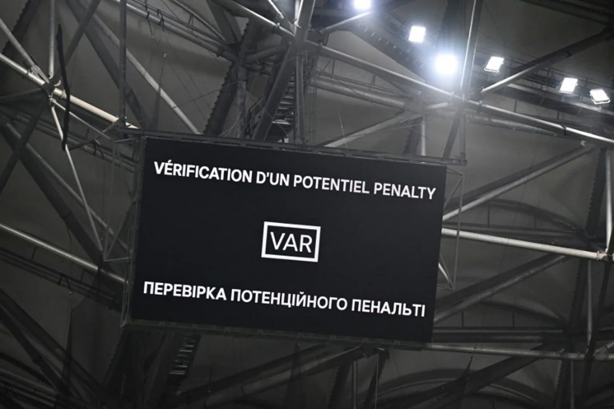 A giant screen shows a VAR (Video Assistant Referee) check for a penalty during the UEFA Europa League knockout round play-off second leg football match between Olympique de Marseille and Shakhtar Donetsk at the Velodrome Stadium in Marseille, southern France, on February 22, 2024.  NICOLAS TUCAT / AFP