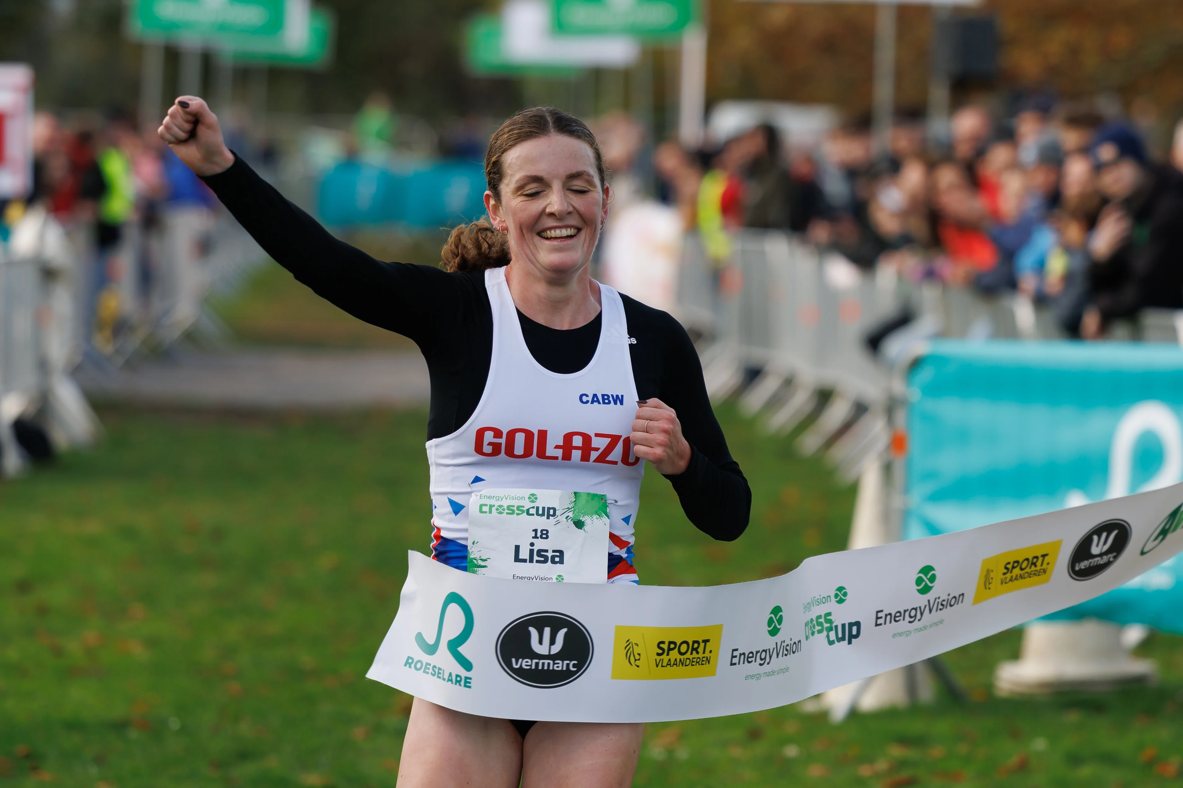 Belgian Lisa Rooms celebrates after winning the women's race at the CrossCup cross country running athletics event in Roeselare, the second stage of the CrossCup competition, Sunday 26 October 2025. BELGA PHOTO KURT DESPLENTER