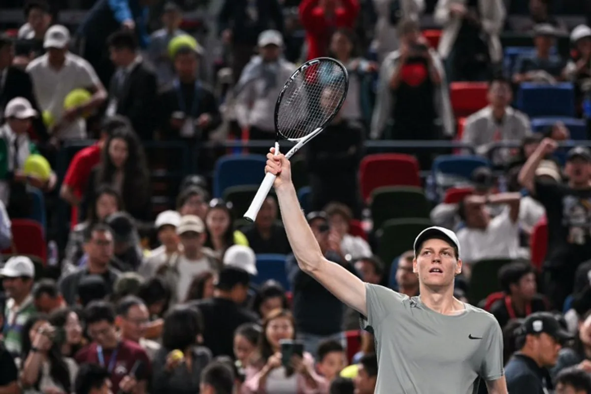 Italy's Jannik Sinner celebrates after his victory against Czech Republic's Tomas Machac during their men's singles semi-final match at the Shanghai Masters tennis tournament in Shanghai on October 12, 2024.  HECTOR RETAMAL / AFP