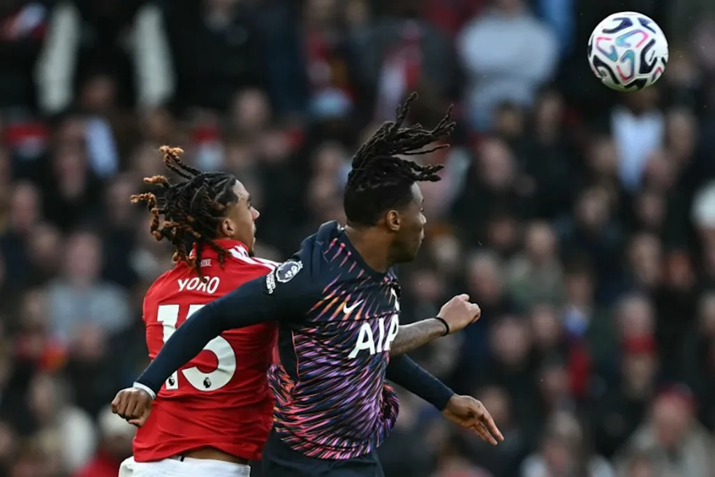 Manchester United's French defender #15 Leny Yoro (L) vies with Tottenham Hotspur's Italian defender #13 Destiny Udogie (R) during the English Premier League football match between Manchester United and Tottenham Hotspur at Old Trafford in Manchester, north west England, on October 10, 2026.  Paul ELLIS / AFP