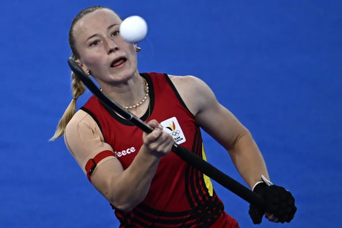 Belgium's forward #06 Charlotte Englebert controls the ball in the women's pool A field hockey match between France and Belgium during the Paris 2024 Olympic Games at the Yves-du-Manoir Stadium in Colombes on July 29, 2024.  JULIEN DE ROSA / AFP