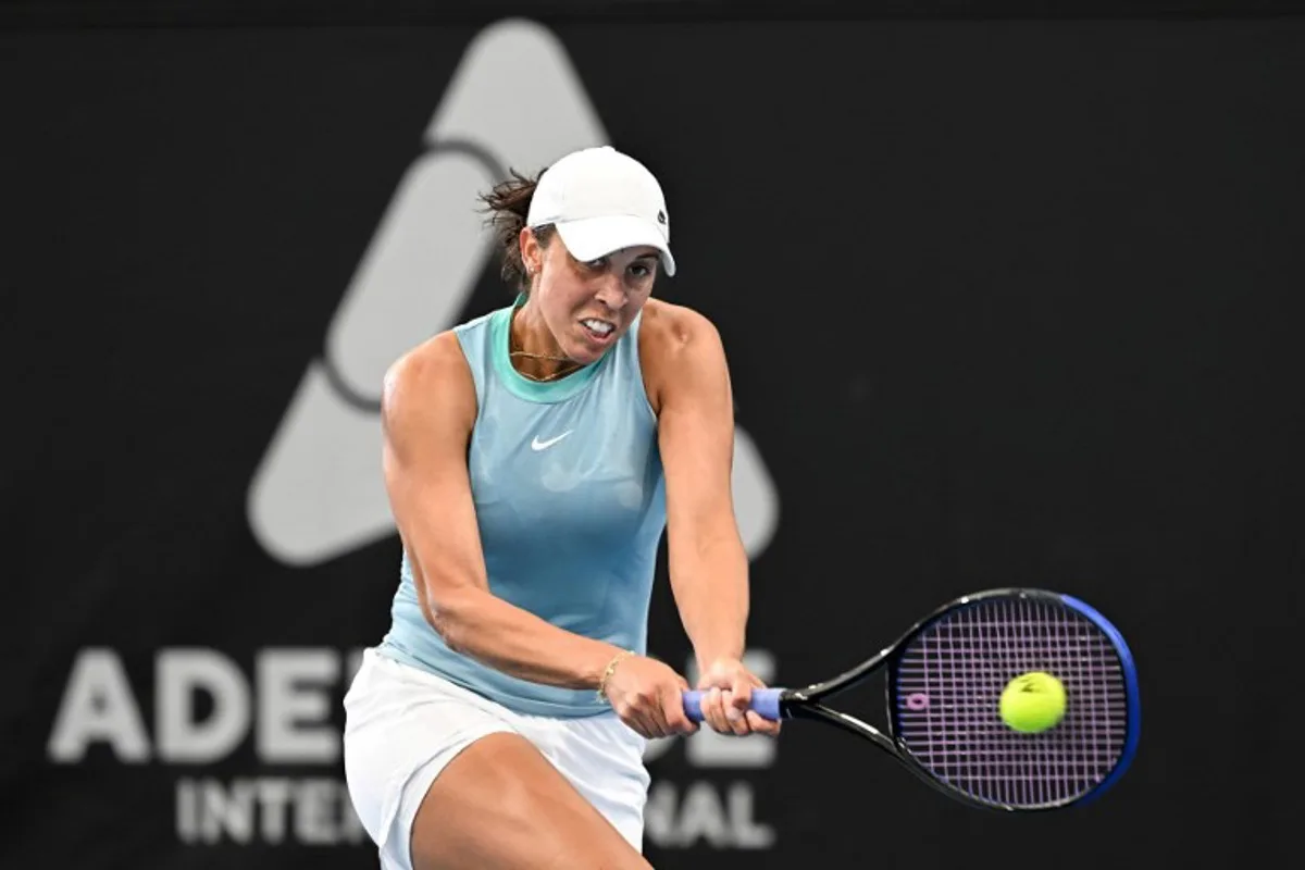 USA's Madison Keys hits a backhand during her women's singles final match against compatriot Jessica Pegula at the Adelaide International tennis tournament in Adelaide on January 11, 2025.   Michael ERREY / AFP