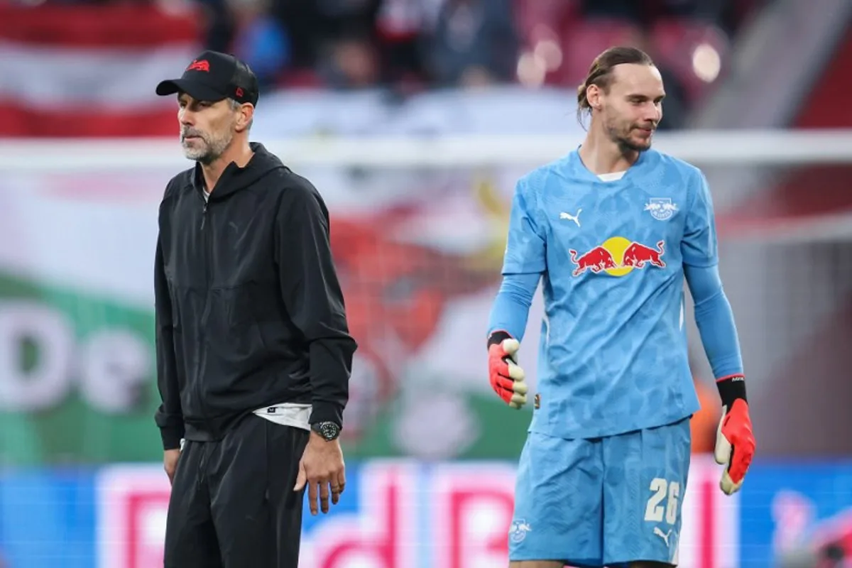 Leipzig's German head coach Marco Rose (L) and Leipzig's Belgian goalkeeper #26 Maarten Vandevoordt react after the German first division Bundesliga football match between RB Leipzig and SC Freiburg in Leipzig, eastern Germany, on October 26, 2024.  Ronny Hartmann / AFP