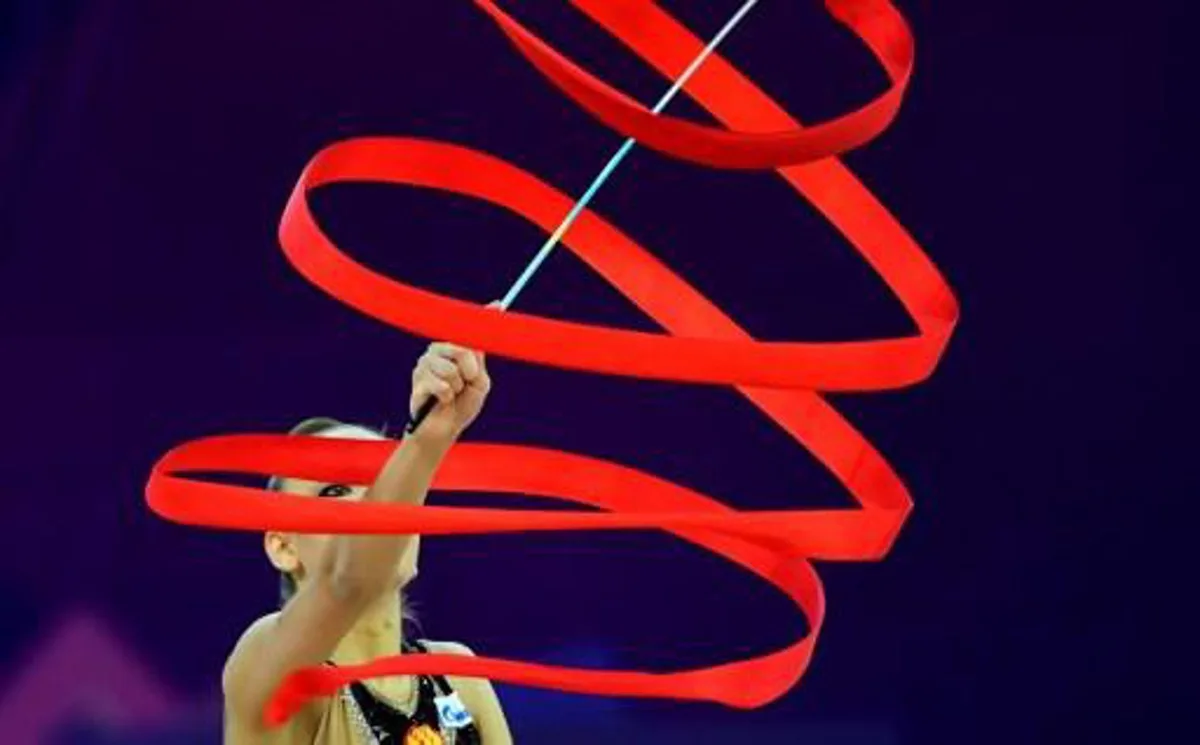 Gold medalist Russia's Dina Averina performs with her ribbon in Papp Laszlo Arena of Budapest on May 21, 2017 during the apparatus final day of 33rd European Rythmic Gymnastic Championships. ATTILA KISBENEDEK / AFP