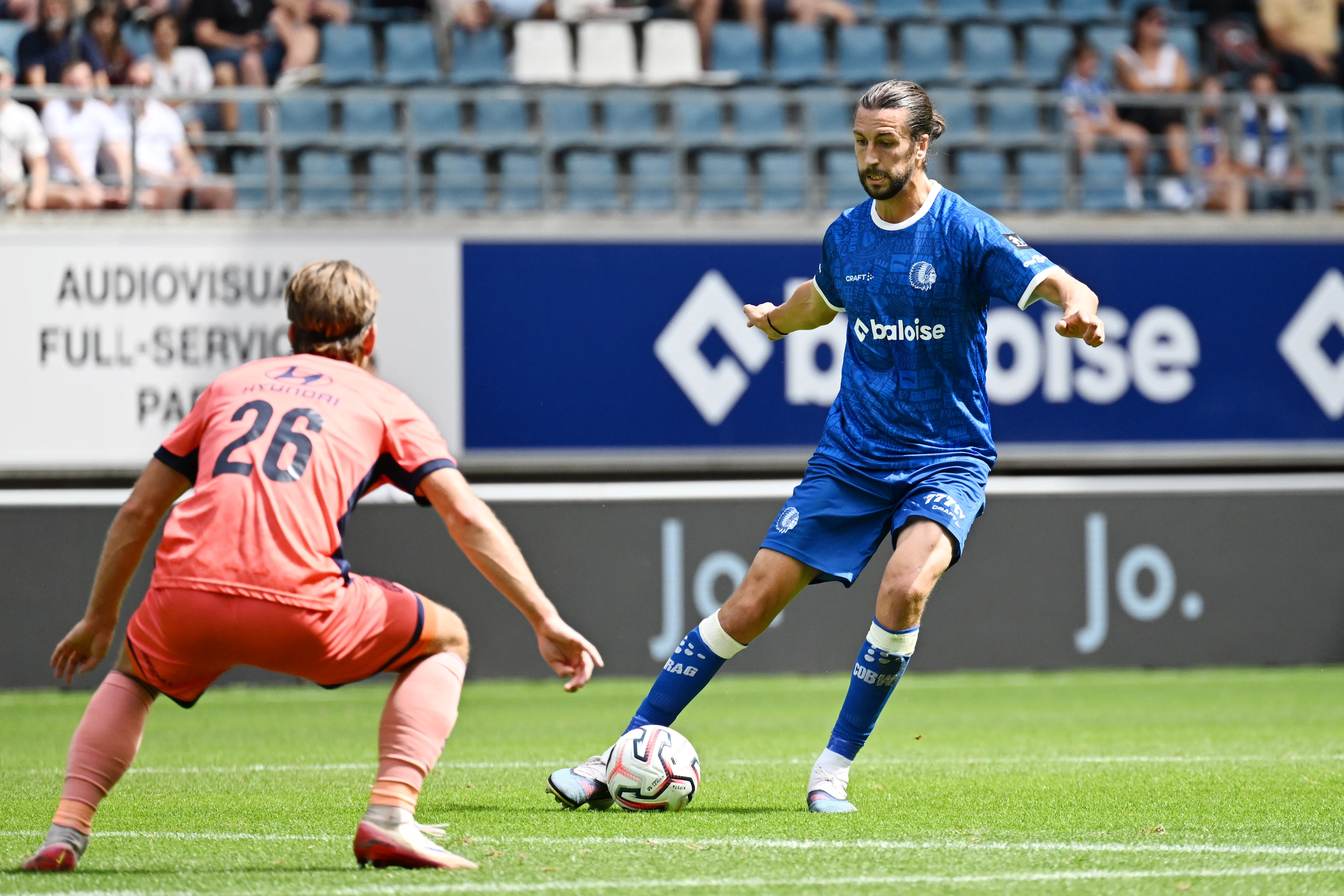Mechelen's Dennis Praet and Gent's Christian Burgess fight for the ball during a soccer match between KAA Gent and KV Mechelen, Sunday 09 August 2026 in Gent, on day 1 of the 2026-2027 'Jupiler Pro League' first division of the Belgian championship. BELGA PHOTO MAARTEN STRAETEMANS