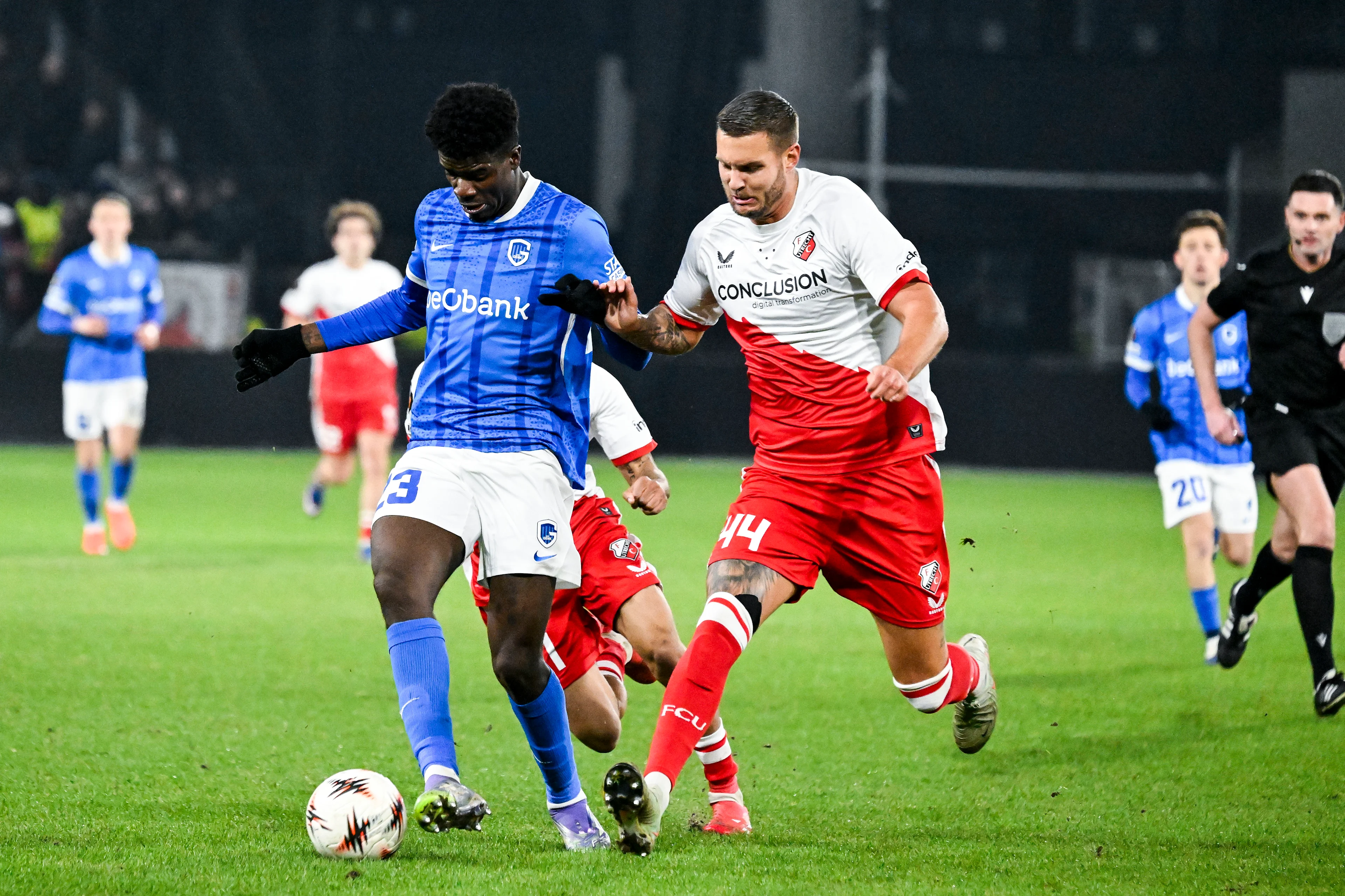 Genk's Bibout Banind and Utrecht's Mike Eerdhuijzen pictured in action during a soccer game between Dutch soccer club FC Utrecht and Belgian KRC Genk, on Thursday 22 January 2026 in Utrecht, Netherlands, the seventh game (out of 8) in the league phase of the UEFA Europa League competition. BELGA PHOTO TOM GOYVAERTS