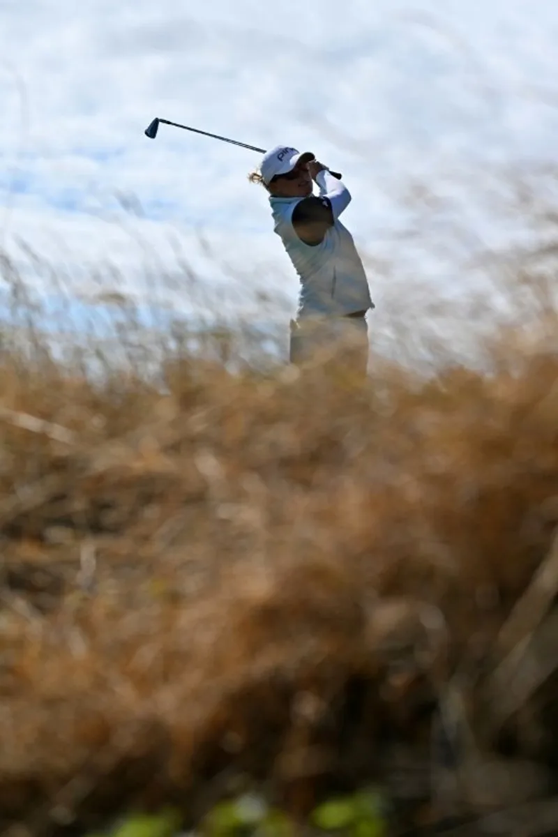 Belgium's Manon De Roey watches a drive from the 4th tee on the first day of the 2026 Women's British Open Golf Championships at Royal Lytham & St. Annes Golf Club, north-west England, on July 30, 2026.   Glyn KIRK / AFP