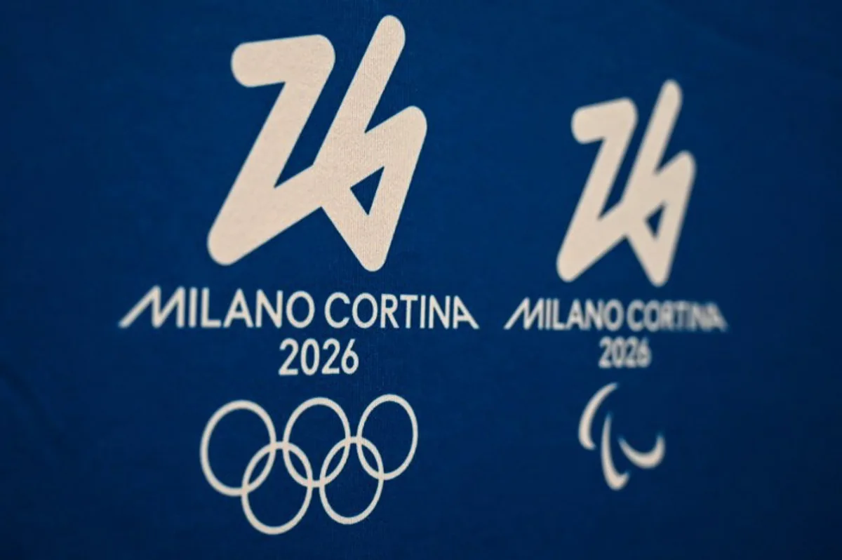 This photograph shows the Milano-Cortina 2026 Winter Olympic and Paralympic Games logos during a press conference to present Team26, the program dedicated to the volunteers of Milano Cortina 2026, in Milan on September 19, 2024.  Piero CRUCIATTI / AFP