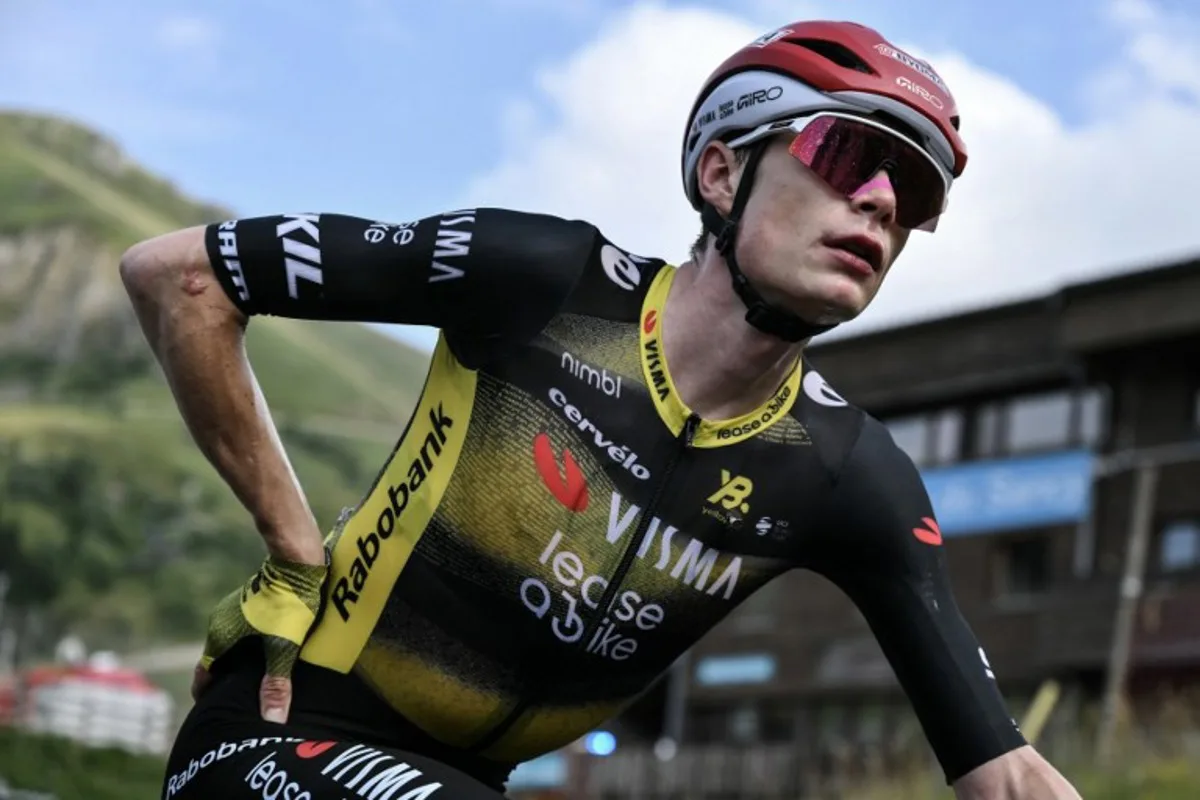 Team Visma - Lease a bike team's Danish rider Jonas Vingegaard looks on after the 10th stage of the 112th edition of the Tour de France cycling race, 165.3 km between Ennezat and Le Mont-Dore Puy de Sancy, in central France, on July 14, 2025. Marco BERTORELLO / AFP