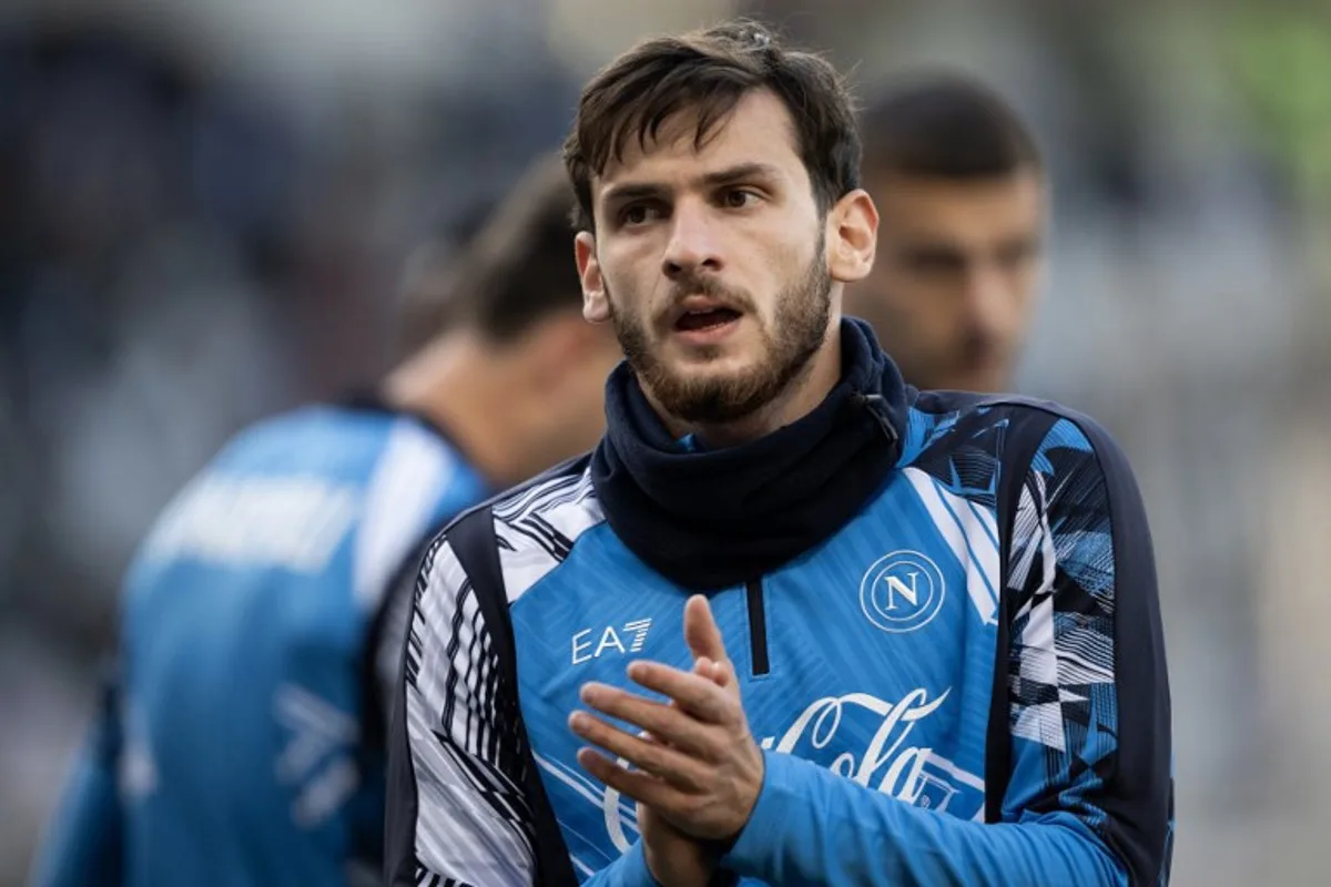 Napoli's Georgian forward #77 Khvicha Kvaratskhelia warms up before the Italian Serie A football match Torino vs Napoli at the "Stadio Grande Torino" in Turin on December 1, 2024.   MARCO BERTORELLO / AFP