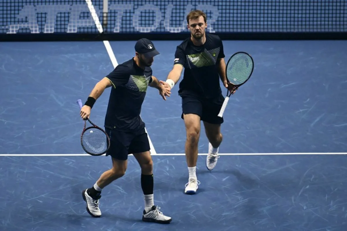 Germany's Tim Putz and Germany's Kevin Krawietz during their final match at the ATP Finals tennis tournament in Turin on November 17, 2024.  Marco BERTORELLO / AFP