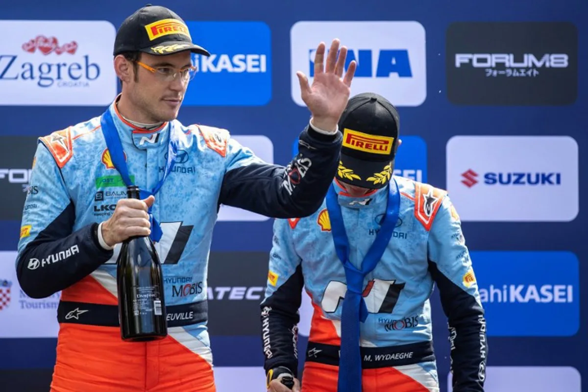 Third-placed Thierry Neuville of Belgium and his co-driver Martijn Wydaeghe of Belgium pose on the podium after the Croatia Rally 2024, part of the FIA World Rally Championship, in Kumrovec, on April 21, 2024.  DAMIR SENCAR / AFP