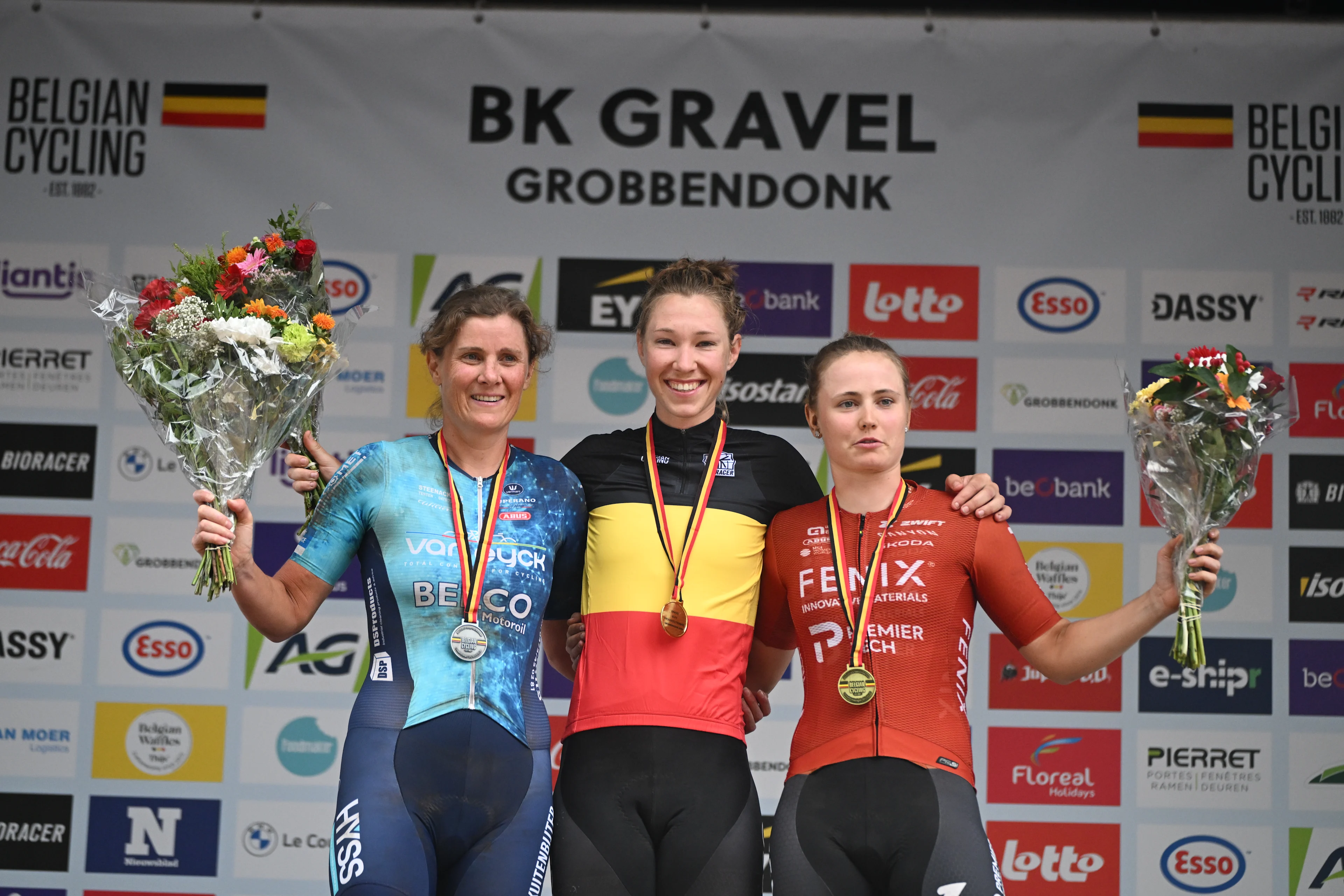 Loes Sels,Nathalie Bex and Marthe Truyen celebrate on the podium of the elite race at the Belgian Gravel Championships, Sunday 16 August 2026 in Grobbendonk. BELGA PHOTO ELIAS ROM