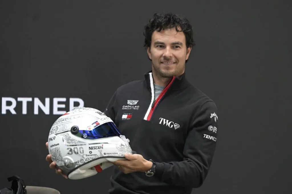 Mexican F1 driver Sergio Perez of Cadillac Team shows his helmet during a press conference in Mexico City, on October 27, 2026, ahead of the upcoming Mexico GP.  Alfredo ESTRELLA / AFP